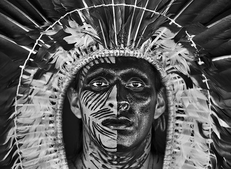 Adão-Yawanawá-in-a-headdress-of-eagle-feathers-Village-of-Nova-Esperança-Rio-Gregório-Indigenous-Territory-State-of-Acre-2016. Sebastia Salgado